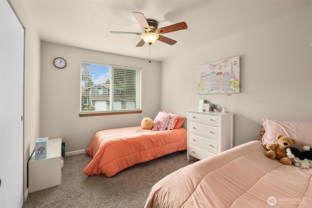 bedroom with carpet flooring, a textured ceiling, baseboards, and ceiling fan