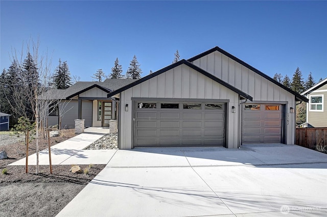 view of front of property featuring board and batten siding, concrete driveway, and a garage