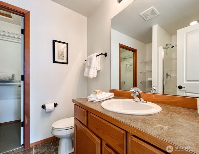 bathroom featuring visible vents, toilet, a stall shower, tile patterned floors, and vanity