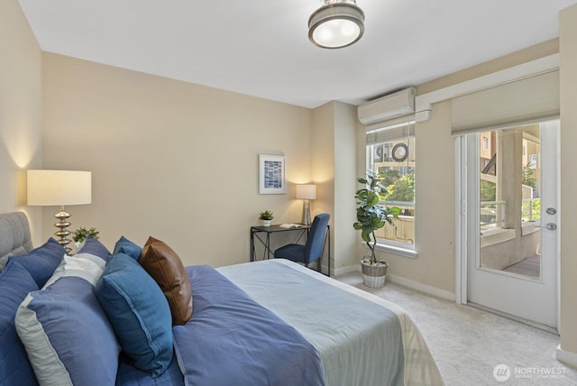 bedroom featuring baseboards, a wall mounted air conditioner, and carpet