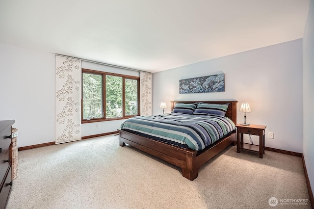 bedroom with carpet and baseboards