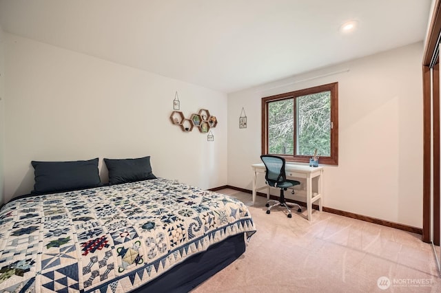 bedroom with recessed lighting, light colored carpet, and baseboards