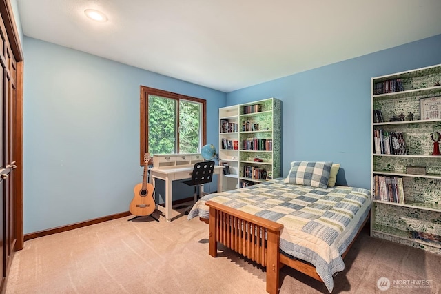 carpeted bedroom with baseboards