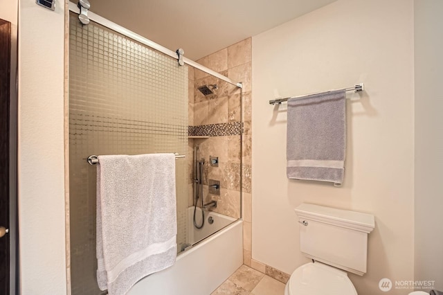 full bath with toilet, baseboards, and combined bath / shower with glass door