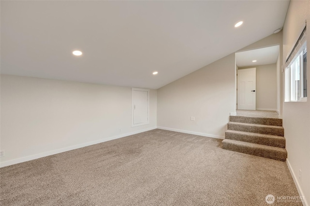 basement featuring stairway, recessed lighting, baseboards, and carpet floors