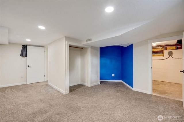 finished below grade area with recessed lighting, visible vents, baseboards, and carpet flooring