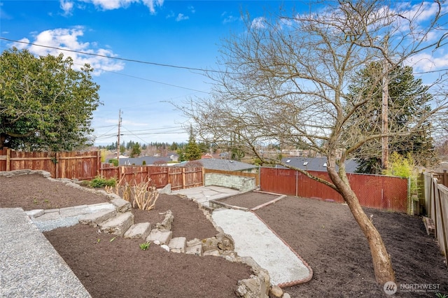 view of yard featuring a fenced backyard