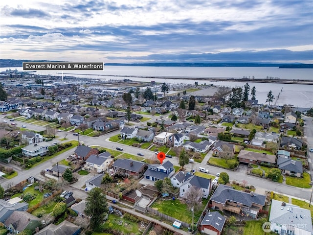 bird's eye view featuring a residential view and a water view