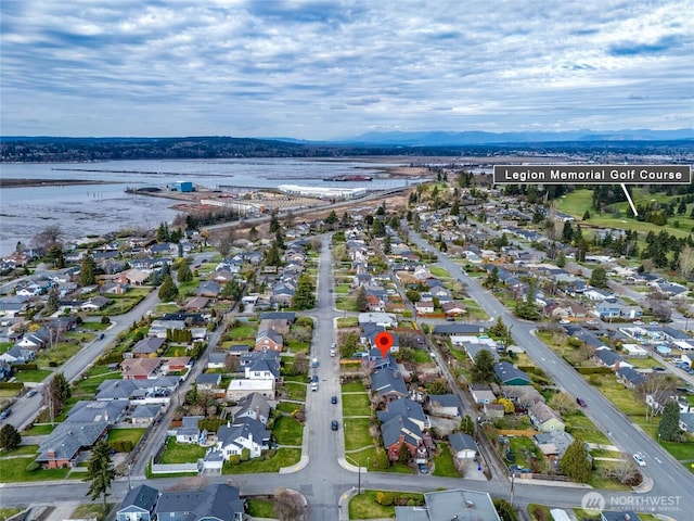 drone / aerial view with a residential view and a water view