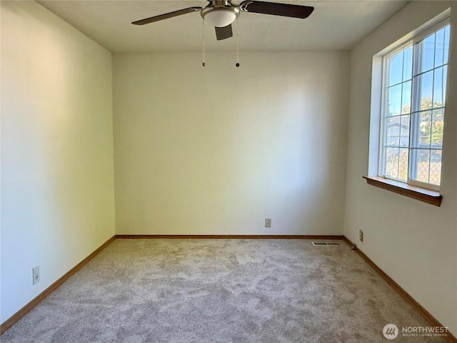 2457 S 52nd St, Tacoma, WA 98409 - unfurnished room featuring carpet flooring, ceiling fan, and baseboards