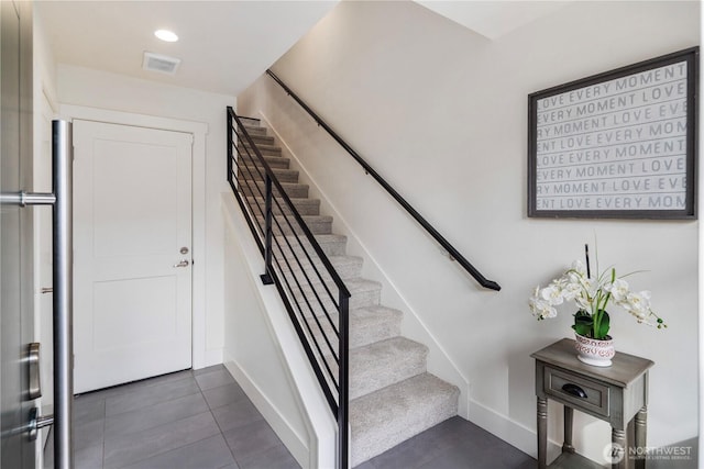 staircase with tile patterned flooring, visible vents, recessed lighting, and baseboards