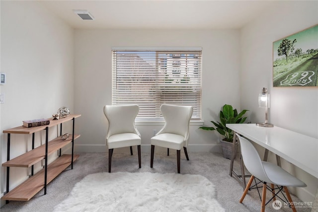 sitting room featuring carpet flooring, visible vents, and baseboards