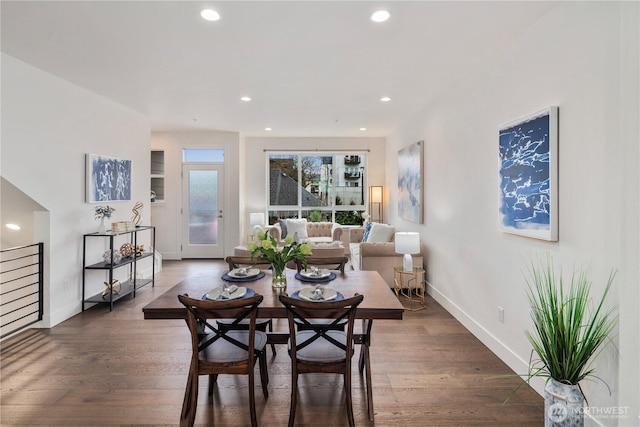 dining area featuring recessed lighting, baseboards, and dark wood finished floors