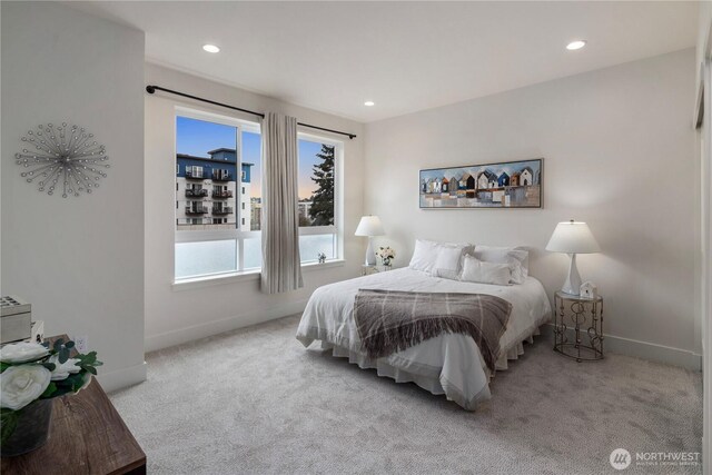 carpeted bedroom with recessed lighting and baseboards