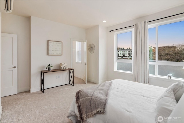 carpeted bedroom with recessed lighting, baseboards, and a wall mounted AC