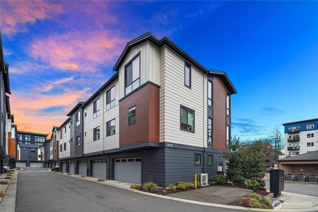 property at dusk with central AC