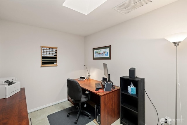 office space with baseboards and visible vents