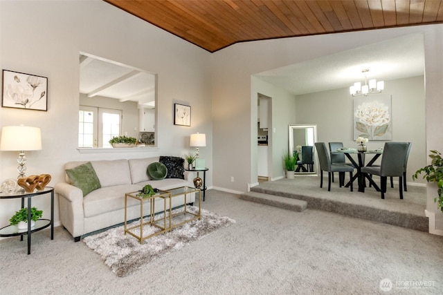 living area featuring lofted ceiling, an inviting chandelier, wooden ceiling, carpet flooring, and baseboards