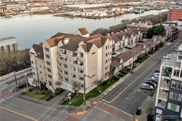 birds eye view of property with a water view