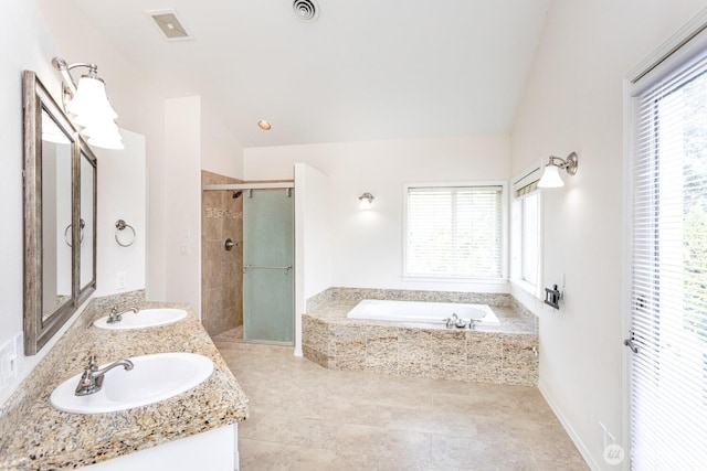 full bath with vaulted ceiling, a bath, visible vents, and a sink