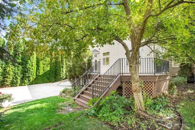 exterior space featuring a wooden deck and stairs