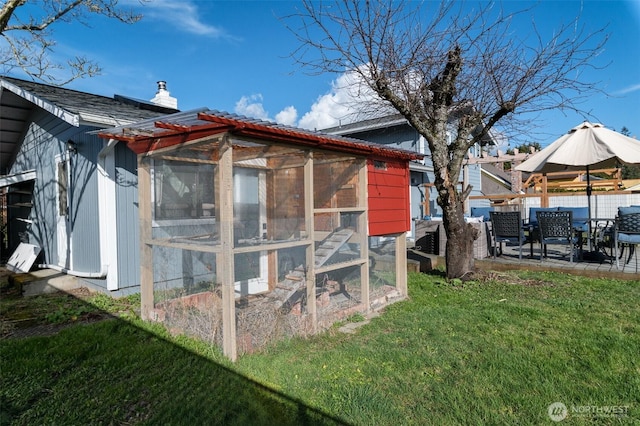 view of poultry coop with a yard and fence