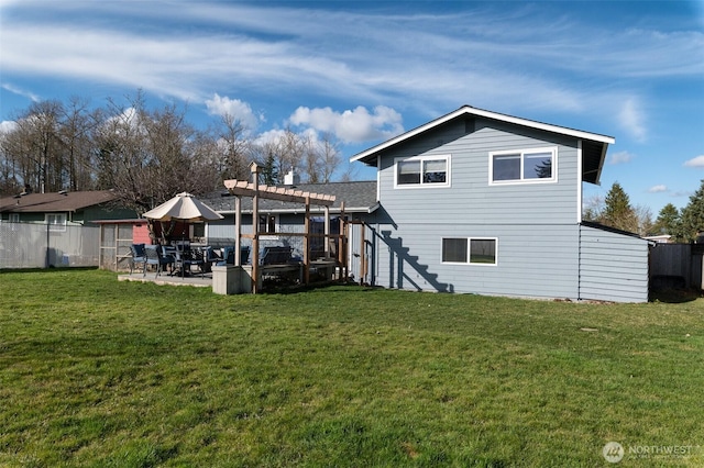 rear view of property with a yard, fence, a patio area, and a pergola