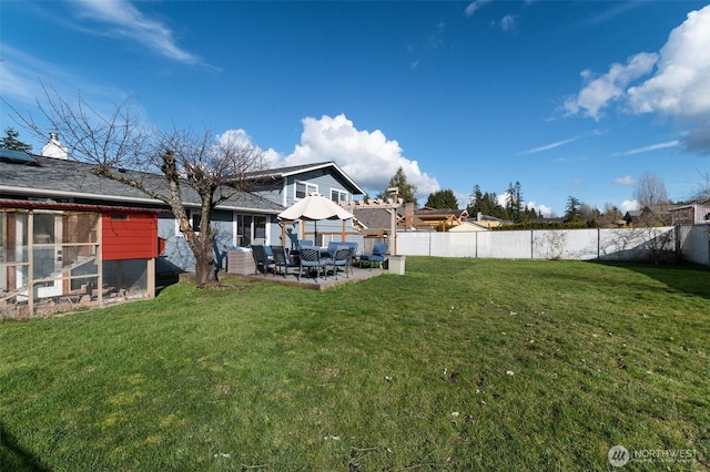 view of yard featuring a patio and fence