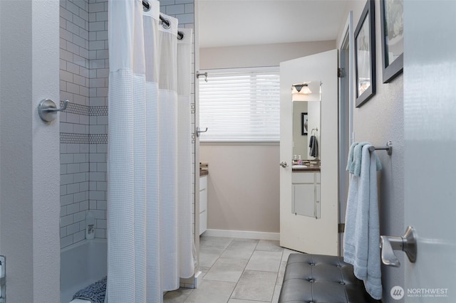 bathroom with tile patterned floors, vanity, and baseboards