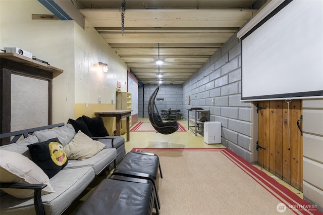 finished basement with tile patterned floors and concrete block wall