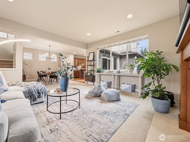 living room with recessed lighting, visible vents, carpet floors, and a healthy amount of sunlight