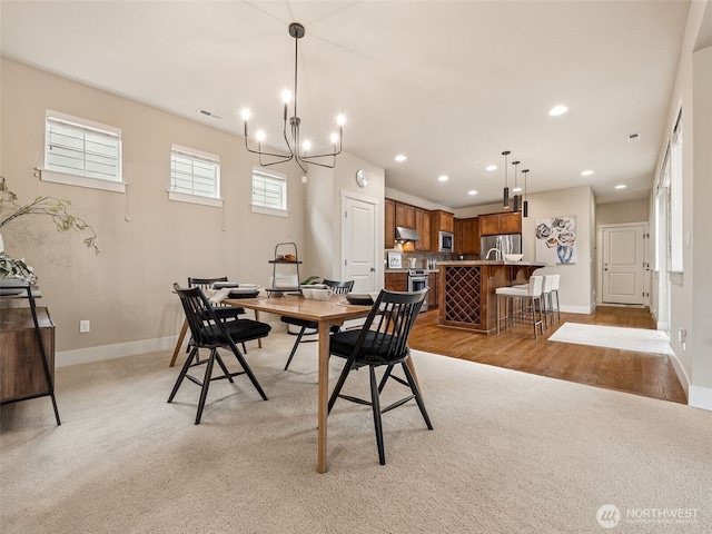 dining area with visible vents, recessed lighting, baseboards, light colored carpet, and a chandelier