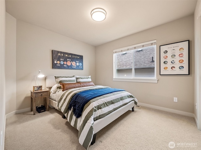 carpeted bedroom featuring baseboards