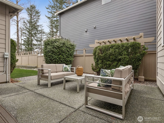 view of patio / terrace with an outdoor hangout area and fence