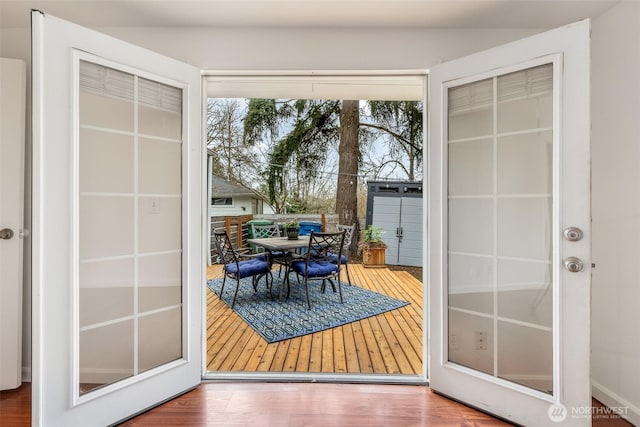 doorway featuring wood finished floors and french doors