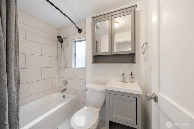 bathroom featuring vanity, toilet, and shower / tub combo with curtain