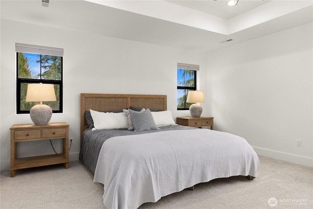 bedroom with light carpet, visible vents, recessed lighting, and baseboards