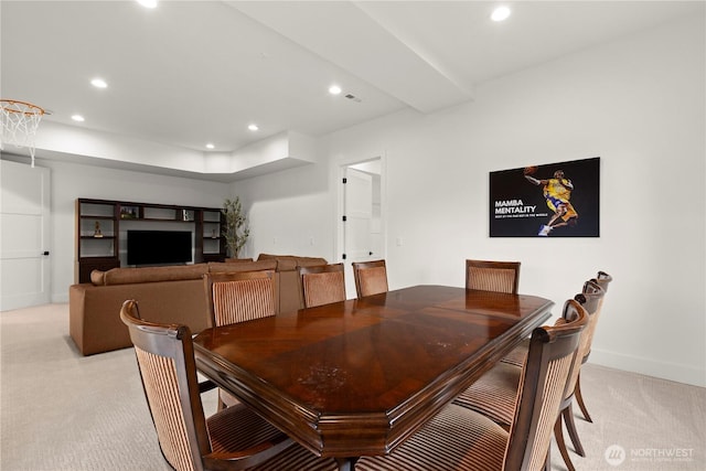 dining space featuring light carpet, recessed lighting, and baseboards