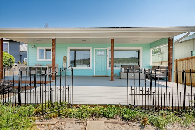 rear view of property with fence