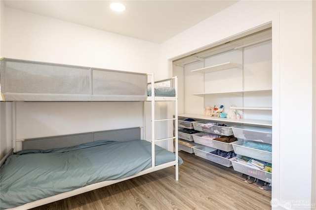 bedroom featuring recessed lighting and wood finished floors