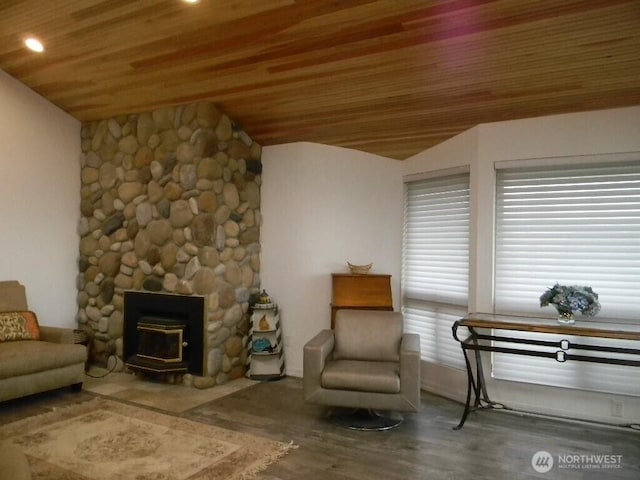 living area featuring lofted ceiling, wood finished floors, and wood ceiling