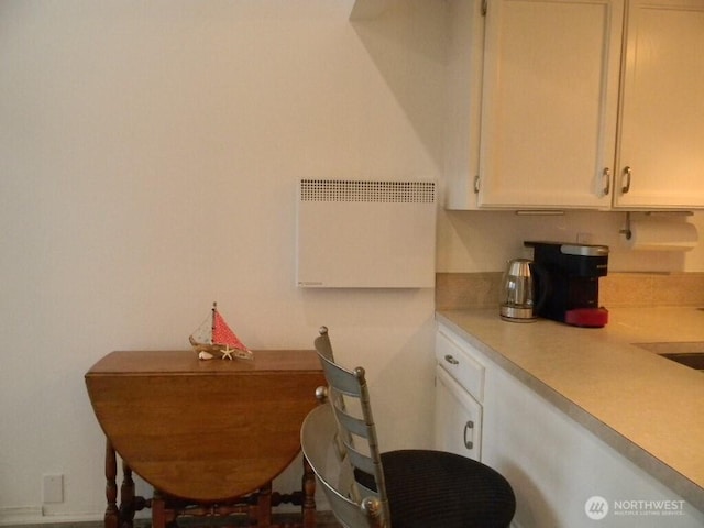 kitchen with white cabinets and light countertops