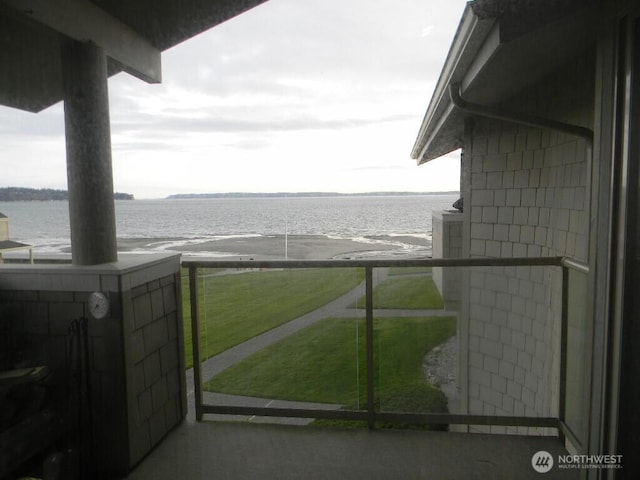 balcony featuring a water view