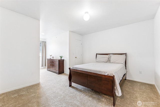 carpeted bedroom with baseboards