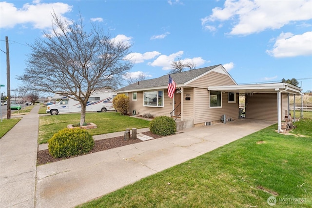 view of front of home featuring entry steps, an attached carport, concrete driveway, and a front yard