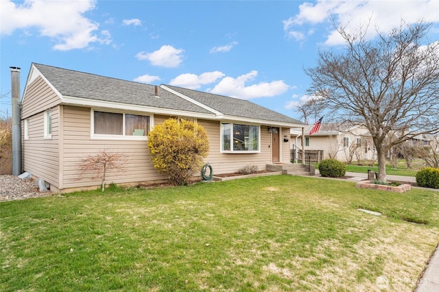 single story home featuring a shingled roof and a front lawn