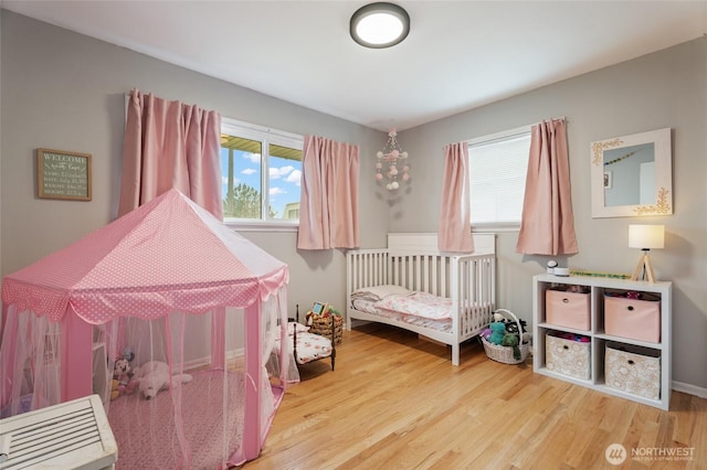 bedroom featuring wood finished floors