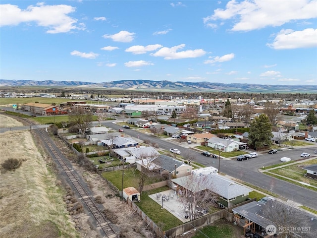 drone / aerial view featuring a mountain view and a residential view