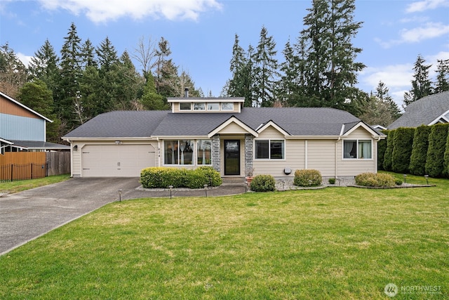 mid-century home with a garage, a front lawn, driveway, and fence