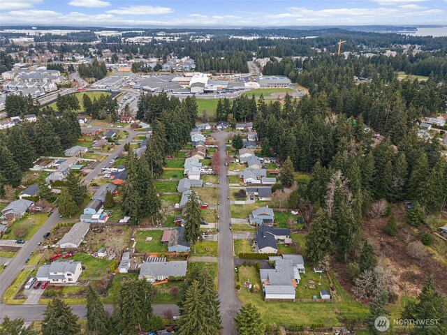 birds eye view of property with a residential view